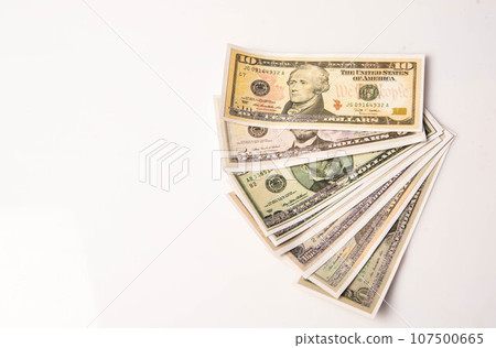 various bills on white background, exchange, spending, currency various bills on white background, exchange, spending, currency 107500665