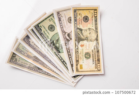 various bills on white background, exchange, spending, currency various bills on white background, exchange, spending, currency 107500672