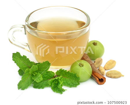 Herbal tea in a cup with different herbs Herbal tea in a cup with different herbs 107500923