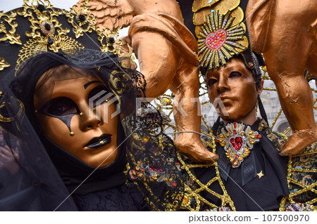 Couple of people dressed up for the Venice Carnival Couple of people dressed up for the Venice Carnival 107500970
