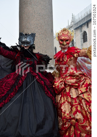 Couple of people dressed up for the Venice Carnival Couple of people dressed up for the Venice Carnival 107501024