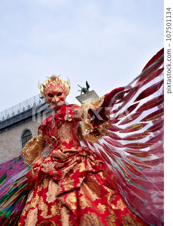 Person dressed up for Carnival of Venice wearing Fenix costume Person dressed up for Carnival of Venice wearing Fenix costume 107501134