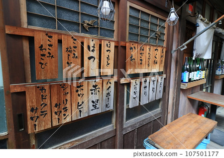 Yakitori menu at a standing bar - handwritten menu 107501177