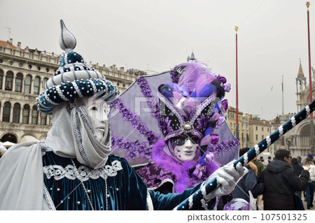 Couple of people dressed up for the Venice Carnival Couple of people dressed up for the Venice Carnival 107501325