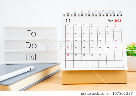 November 2023, Monthly desk calendar for 2023 year on wooden table. 107501357