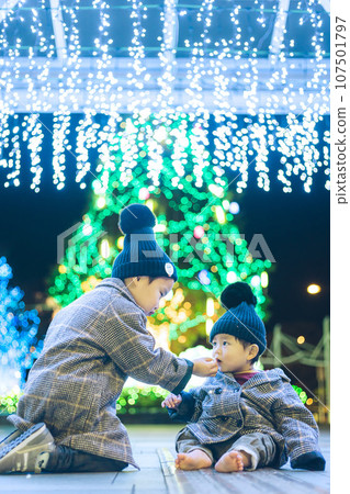 Children enjoying Christmas illuminations Children enjoying Christmas illuminations 107501797
