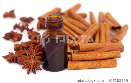 Some aromatic cinnamon with star anise and essential oil Some aromatic cinnamon with star anise and essential oil 107502539