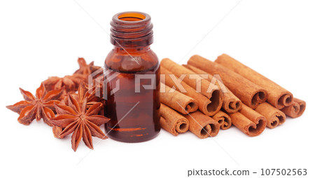 Some aromatic cinnamon with star anise and essential oil Some aromatic cinnamon with star anise and essential oil 107502563