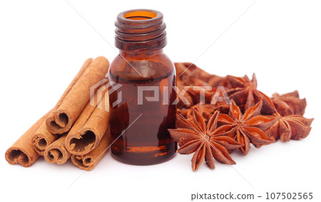 Some aromatic cinnamon with star anise and essential oil Some aromatic cinnamon with star anise and essential oil 107502565