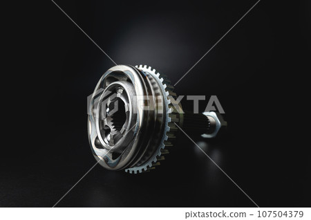 CV joint new from a set of spare parts on a black background. Car Chassis Parts 107504379