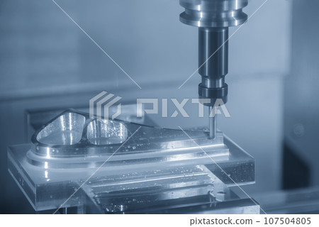 The CNC milling machine cutting mold part by solid ball end mill tool. The CNC milling machine cutting mold part by solid ball end mill tool. 107504805