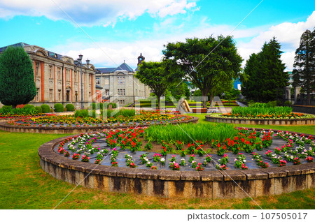 Former Yamagata prefectural assembly building, local museum Bunshokan and flowerbed in spring with beautiful blue skies 107505017