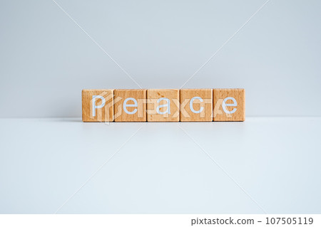 Wooden blocks form the text "Peace" against a white background. 107505119