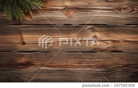 On a textured wooden surface, fresh pine branches. On a textured wooden surface, fresh pine branches. 107505308