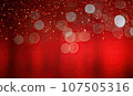 Diverse confetti and blurred light circles dance on a vibrant red background. 107505316