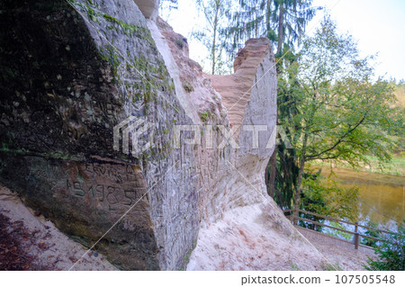 Sand cliff Sietiniezis on the bank of the Gauja river. Gauja National Park, Latvia 107505548