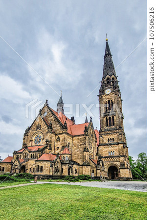 Saint Martin church in Neustadt, Dresden, Germany. Amazing architecture with high towers and red roof. Saint Martin church in Neustadt, Dresden, Germany. Amazing architecture with high towers and red roof. 107506216