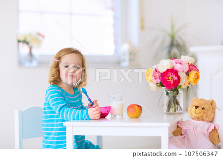 Baby eating vegetables. Solid food for infant. 107506347