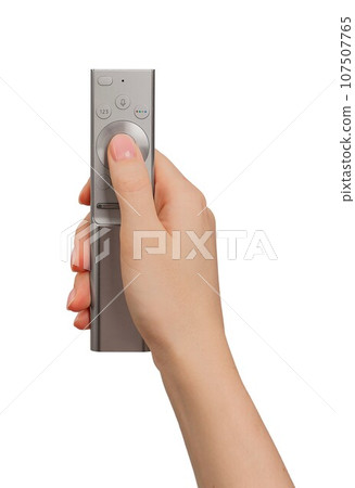 Hand holding, using remote control, TV channel turning on and off Hand holding, using remote control, TV channel turning on and off 107507765