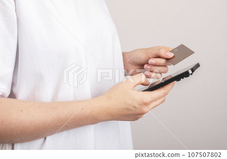 Paying online using smartphone and credit card. Internet payment concept 107507802