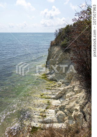 Black sea coast. bald mountain. Beautiful blue sea in Novorossiysk Black sea coast. bald mountain. Beautiful blue sea in Novorossiysk 107507963