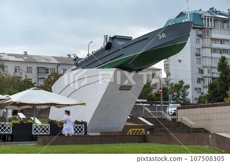 Russia, Novorossiysk. Monument torpedo boat inscription to the heroes of the sailors of the Black Sea coast on the embankment in the city near the port August 18, 2023 107508305