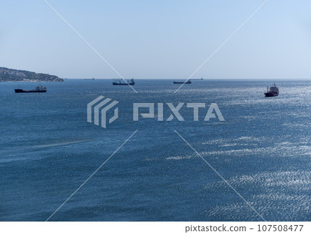 Large cargo ship in the Black Sea in the calm in Novorossiysk Large cargo ship in the Black Sea in the calm in Novorossiysk 107508477