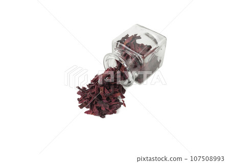 Dried beetroot slices falling out of the glass jar. food ingredient. Dried beetroot slices falling out of the glass jar. food ingredient. 107508993