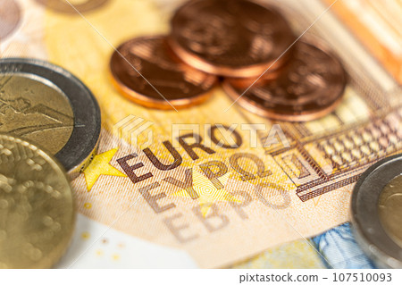 Euro money, paper banknotes and coins close-up macro Euro money, paper banknotes and coins close-up macro 107510093