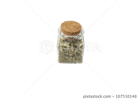Dried leaves o Lemon verbena in latin Aloysia citrodora in a glass jar isolated on white background. Medicinal herb. Dried leaves o Lemon verbena in latin Aloysia citrodora in a glass jar isolated on white background. Medicinal herb. 107510148