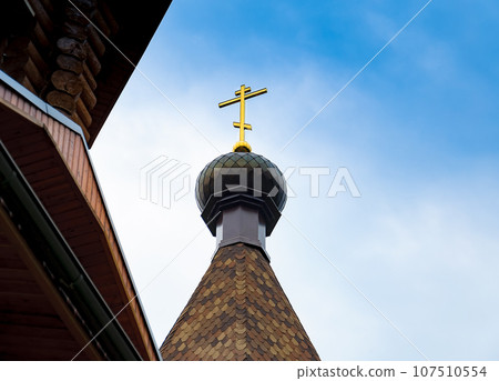 Golden Orthodox cross on the dome of the cathedral. 107510554