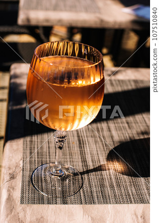 Wine glass filled with sparkling rose wine. Wine glass filled with sparkling rose wine. 107510840