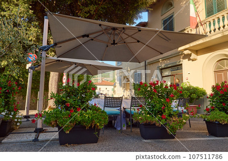 Cozy street with tables of cafe old town street in Reggello village, in the region of Tuscany, Italy. Architecture Cozy street with tables of cafe old town street in Reggello village, in the region of Tuscany, Italy. Architecture 107511786