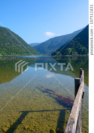 Nature background. A lake in Italian Alps. Lombardy, Italy. September 2023 107511831
