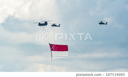 Military helicopter hoisting the national flag on Singapore Independence Day Military helicopter hoisting the national flag on Singapore Independence Day 107514085