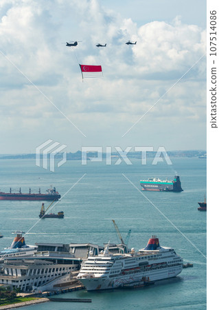 Military helicopter and luxury cruise ship raising the national flag 107514086
