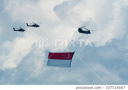 Military helicopter hoisting the national flag on Singapore Independence Day Military helicopter hoisting the national flag on Singapore Independence Day 107514087
