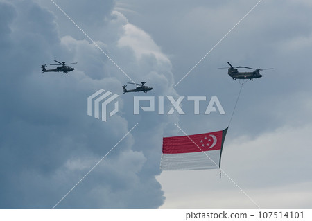 Military helicopter hoisting the national flag on Singapore Independence Day Military helicopter hoisting the national flag on Singapore Independence Day 107514101