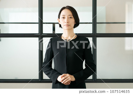 A woman standing in mourning clothes 107514635