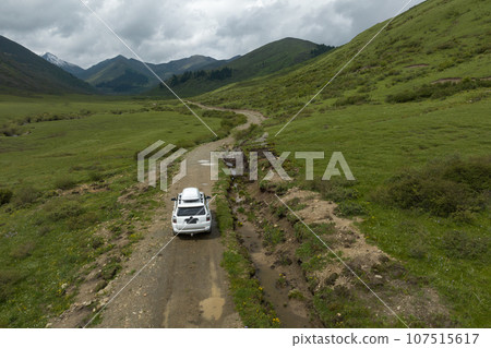 Car road trip on the high altitude mountain trail, China Car road trip on the high altitude mountain trail, China 107515617