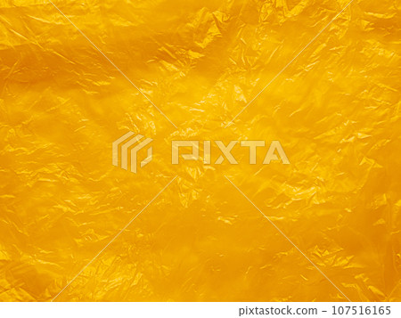 Orange Plastic Texture Wrap Overlay Yellow Background Effect Bag Sticker Foil Pattern Wrinkle Film Grunge Mockup Package Backdrop Scene Color Summer Clear Mockup Poster Glossy Wall Sheet Wrapping. 107516165