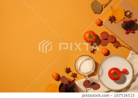 Yellow background featured some types of spice, tomatoes and a glass cup of milk. Thanksgiving Day will be celebrated as a dinner party with family and friends Yellow background featured some types of spice, tomatoes and a glass cup of milk. Thanksgiving Day will be celebrated as a dinner party with family and friends 107516515