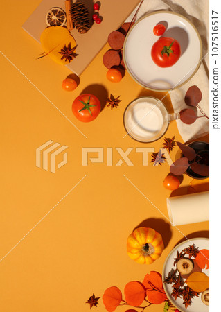 Concept of fall season and Thanksgiving day with fruits, spices and autumn leaves on yellow background. Thanksgiving is the time for traveling 107516517
