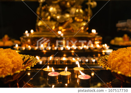 Candle burning for Ganesh statue Diwali Festival with  on black background. 107517730