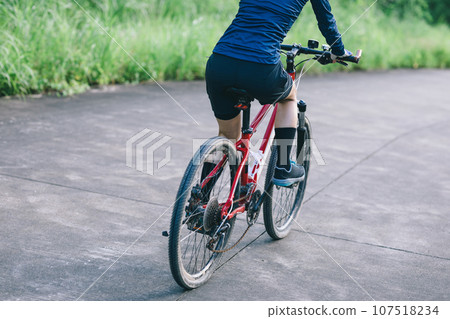 Riding bike in spring forest 107518234