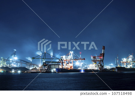 Night view of a plant in the coastal industrial area of Nagoya Port that is actively smoking Night view of a plant in the coastal industrial area of Nagoya Port that is actively smoking 107518498