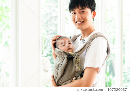 Young dad cradling his baby Young dad cradling his baby 107520087