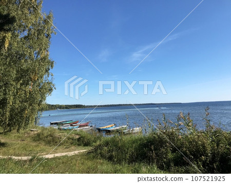 Many boats moored on the lake. Lake Naroch. Many boats moored on the lake. Lake Naroch. 107521925