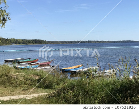 Many boats moored on the lake. Lake Naroch. Many boats moored on the lake. Lake Naroch. 107521926