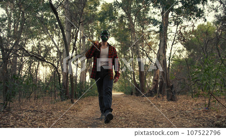 Murder Man Walk With Axe In The Forest 107522796